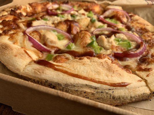 BBQ chicken pizza on their thick crust