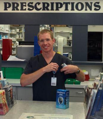 Albert, ready to help from behind the counter.