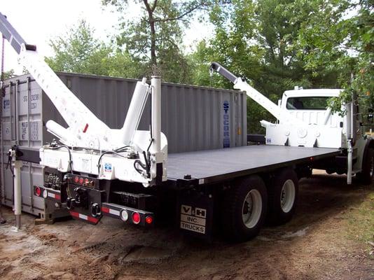 Crane Trailer lifting 20' unit to move to storage for residential customer.