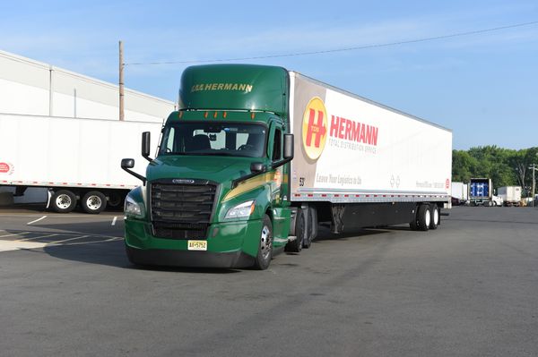 A Hermann truck and trailer offering dedicated and contract transportation solutions