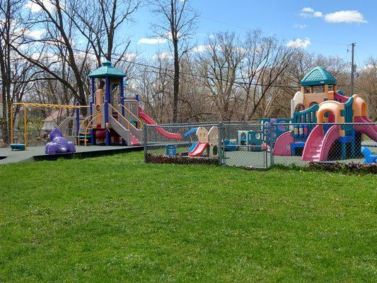 As you drive up you will  notice our playground areas.  We have rubber matting in the play area, a grassy area and a blacktop to play on too