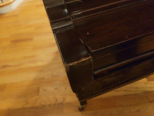 Smashed in corners of antique mahogany mid century piano.