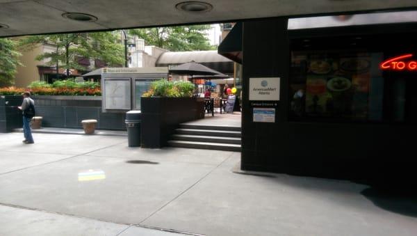 Street level, top of escalators after leaving the post office.