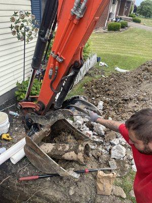 Part of the pipe, and literally crap that he had to dig out of the ground