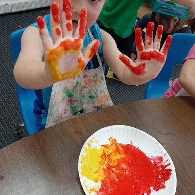 A sensory experience while Color Mixing primary colors to create secondary colors using finger paint.