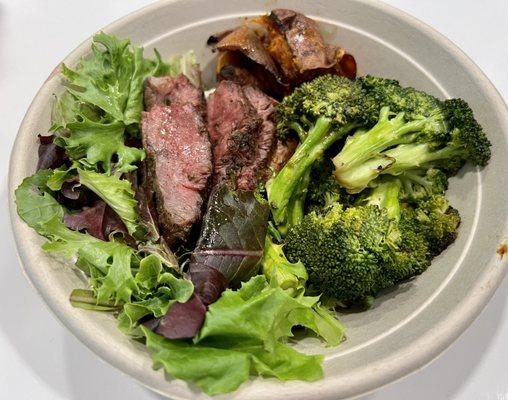 Herb Marinated Steak with mixed greens, roasted sweet potato, and sauteed broccoli - $17.95.