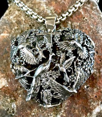 Sixteen birds in this sterling silver heart, unique piece. Cast by hand, collectible piece.