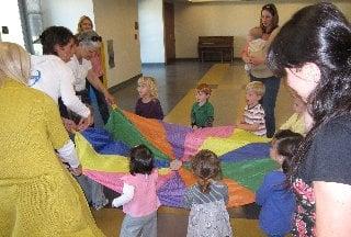 Mommy or Daddy and Me class having fun with our parachute.