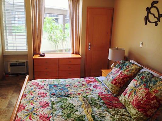 King-size bed is firm and comfortable. Includes A/C unit , ceiling fan and flat screen TV.