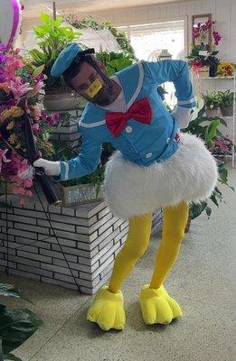 Mitch striking a teapot pose inside the florist, looking absolutely quackers! Mitch in embarrassing costume for lost bet