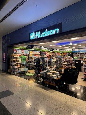 If you zoom in the woman with the mask blue shirt and red brown hair. In terminal 1 Hudson news stand