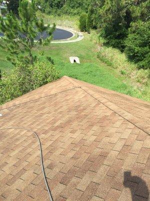 Asphalt shingle roof after pressure washing to remove algae/mildew and grime.