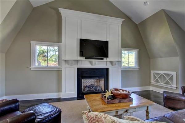 Bonus room over garage with custom mantel and built in wine racks.