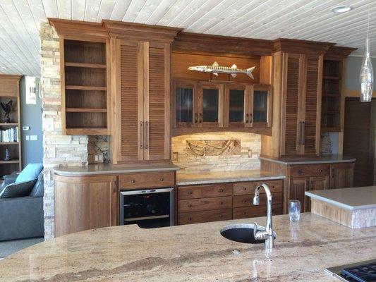 Natural Walnut kitchen hutch and wine bar.  White washed pine T & G ceiling sets the tone.