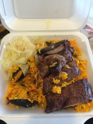 Steak seafood rice and cabbage.