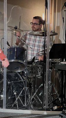 Drummer playing during our worship time.