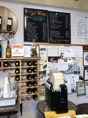 Selection of bottles to go or enjoy by the glass in store. Also a front row seat of the wine slushie machine.