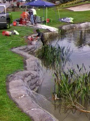 Creating a riprap retaining wall on a golf course water hazard