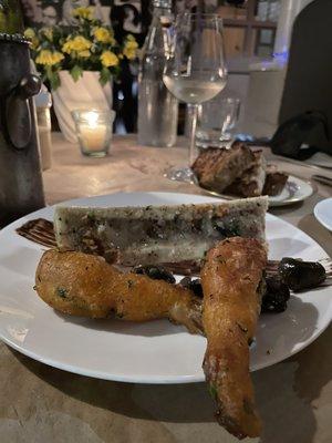 Special appetizer with bone marrow, escargot, fried frog legs and black garlic