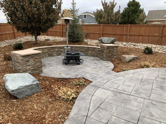 Stamped concrete with stone seating wall