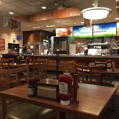 Interior, old school seating with lots of modern kitchen ware I don't see at my usual Arby's locations!