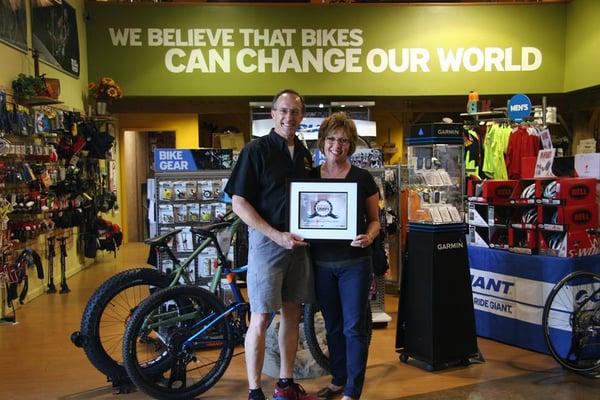 This is Joe and Cheryl accepting the award for America's top rated bike shop in 2014.