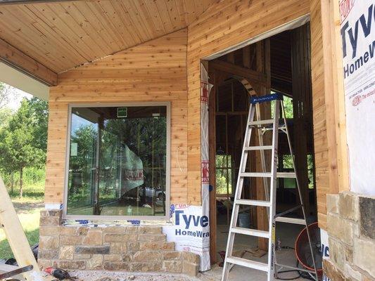 New construction front porch with custom cedar.