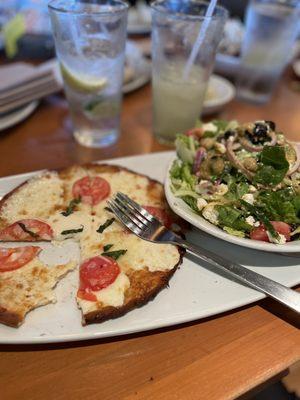 Cauliflower three cheese abs tomatoes pizza w/ Greek salad.