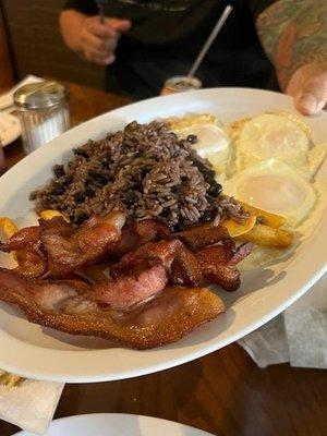 Cuban congri Moro, bacon, sunny side eggs, french fries