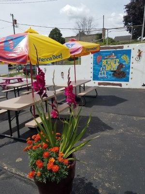 Lots of outdoor seating.... And beautiful flower pots