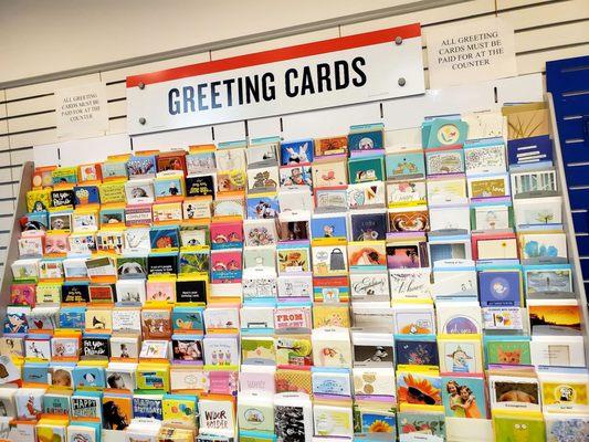 They sell greeting cards and postcards. The postcards come in packs.