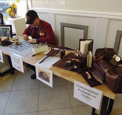 Leatherworker. Local artisans come in for demos.