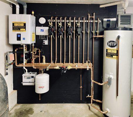 This beautifull install is a result of collaboration with Eastern Propane. Notice a little "Hot dog" hydronic heater to keep garage warm.