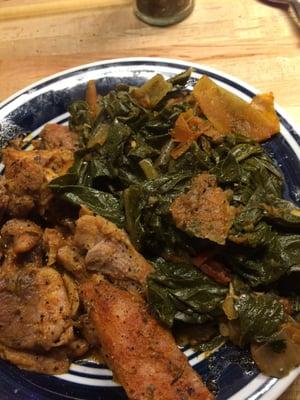 Blackened chicken in creole sauce and collard greens