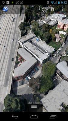 Google Earth shot. Yes it's right under the freeway.