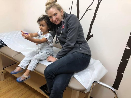 Katelyn with one of our littlest patients