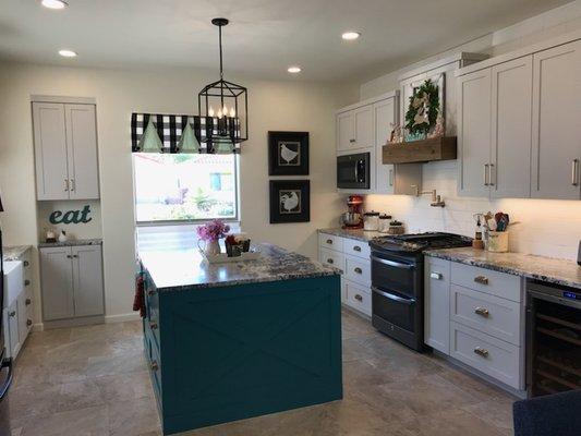 A kitchen makeover adds charm with paint, window treatments, new cabinets. Always working with the client as a team to express their style.