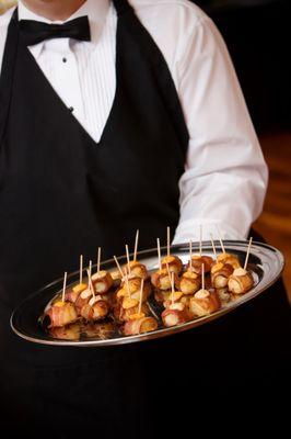 Jason Serving Date Wrapped Hors d'oeuvres.