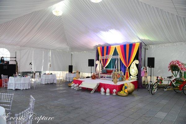 Tent, tent liner, chairs, tables, decor, sound, lighting, flooring, chandeliers, stage