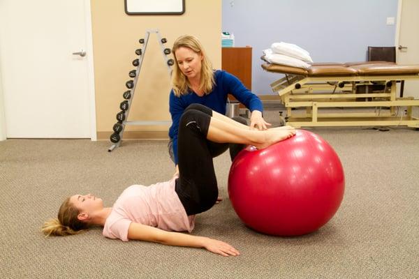 Katie working one-on-one with a patient