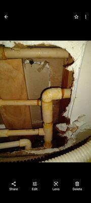 Leaky water lines in wall under kitchen sink