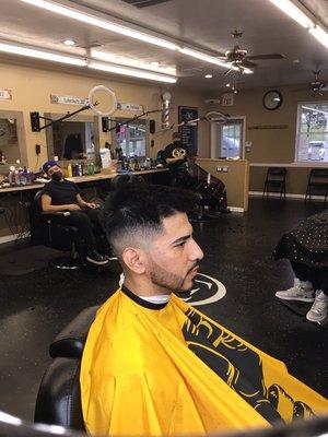 Mid skin fade with sharp beard line up!