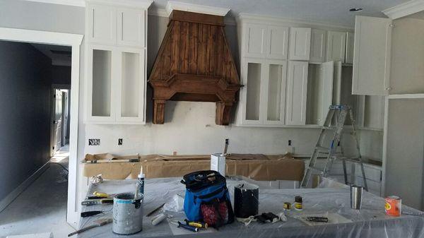 New residential at the King oak. Painting cabinets, stained vent Hood.