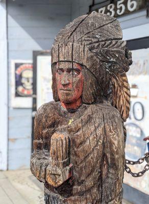 Vintage Wood Indian outside marks when shop is open.