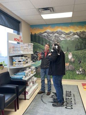 Dr. Nick discusses cat food options with a client and the patient!