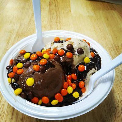 Warm cookie dough on the bottom, two scoops of ice cream and Reese's pieces and fudge sauce