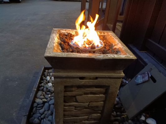 Fire pit behind back porch