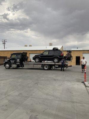 Large truck to tow our SUV with a bike and roof rack.