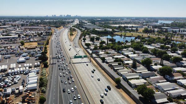 Drone captured image West Sacramento of I-80 with Sacramento in the background.