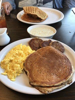 Chicken and waffle sandwich(do not order)  Grits- yum just add salt n pepper  Pancakes and eggs yum- Sausage- yuck